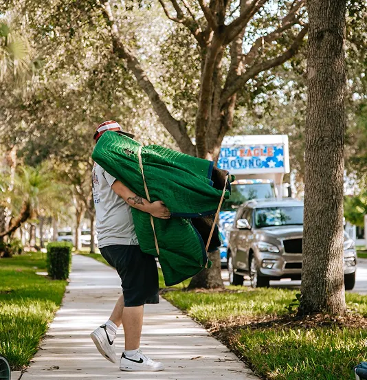 Professional movers handling furniture