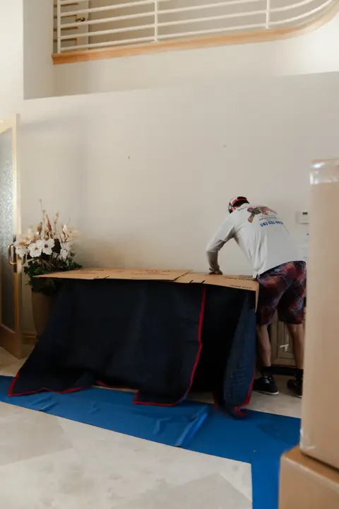 Bald Eagle Moving apartment setup with protected furniture
