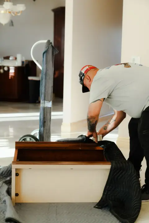 Bald Eagle Moving crew member handling a large household item